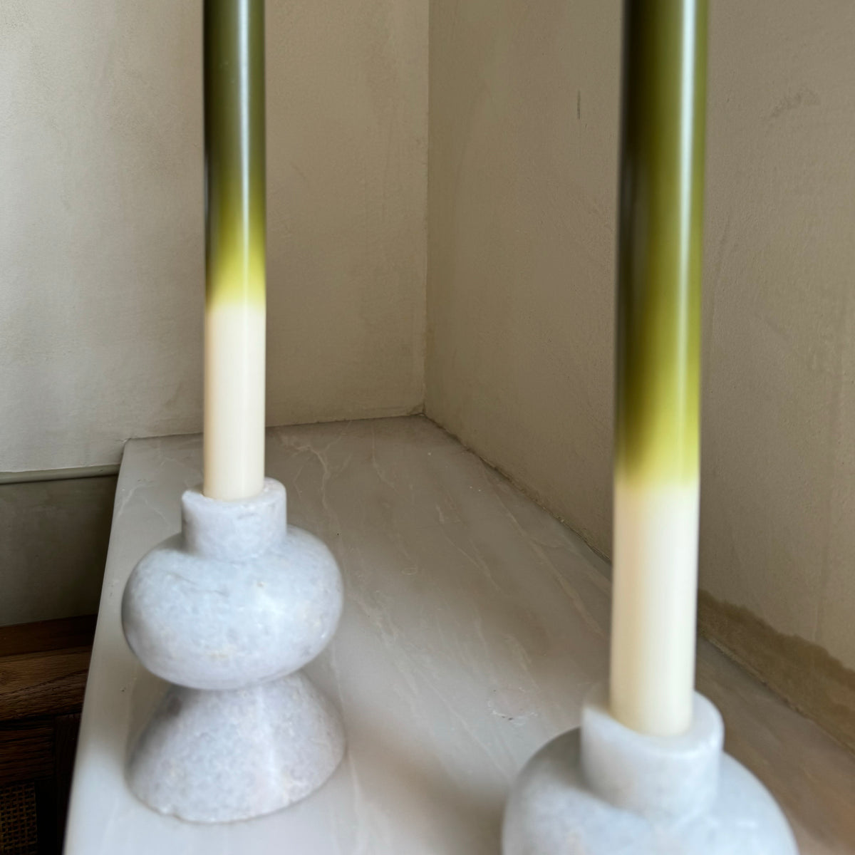 Olives ombré dinner candles by Pygmalion London, a hand-poured pair in deep olive green, chartreuse and off-white