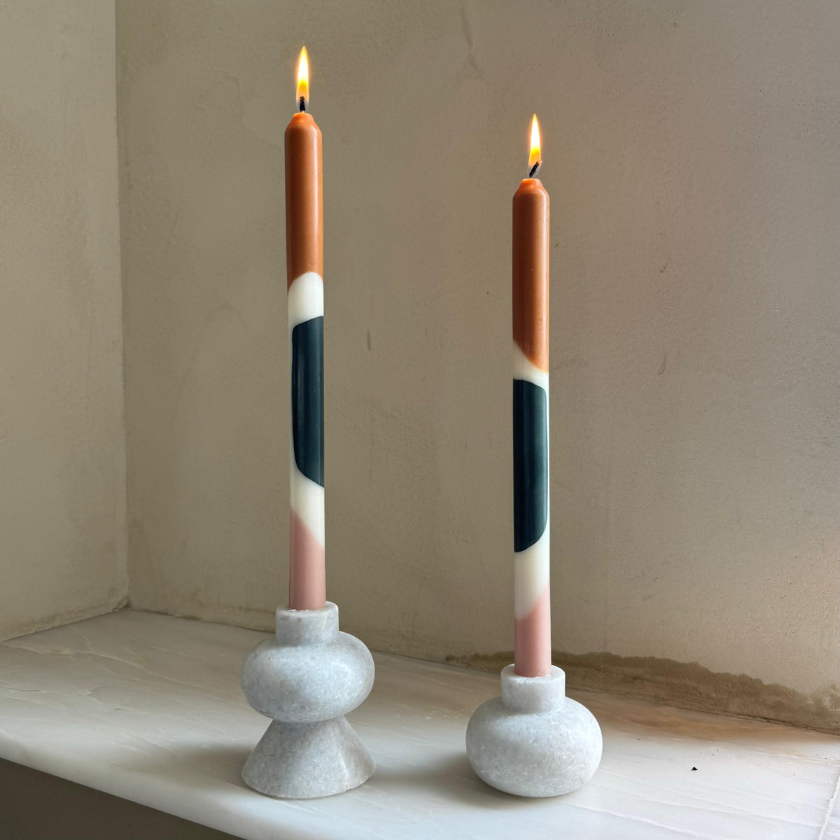 Munro colour block dinner candles by Pygmalion London, a hand-poured pair in off-white, brown, forest green and apricot