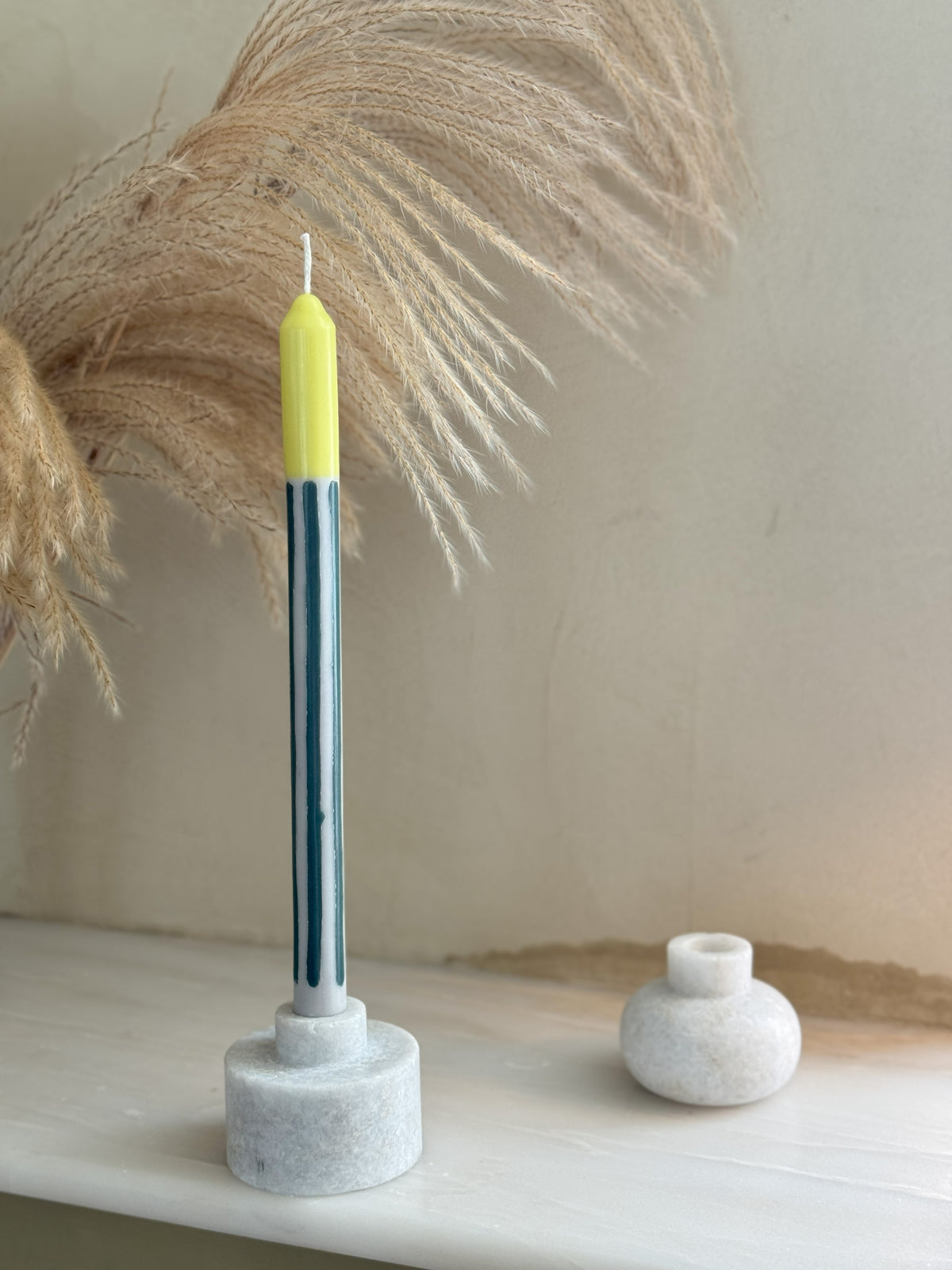 Bergamot striped dinner candles by Pygmalion London, a hand-poured pair in racing green, off-white and pistachio yellow