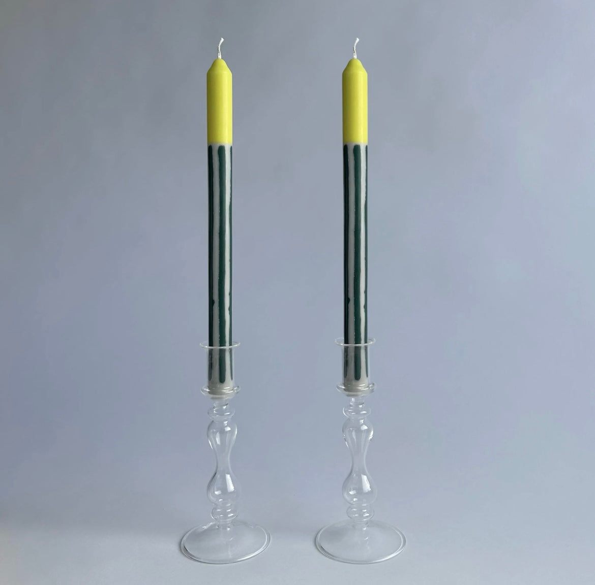 Bergamot striped dinner candles by Pygmalion London, a hand-poured pair in racing green, off-white and pistachio yellow