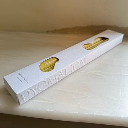 Piccalilli sculptural dinner candles by Pygmalion London, a hand-poured pair in mustard yellow and off-white