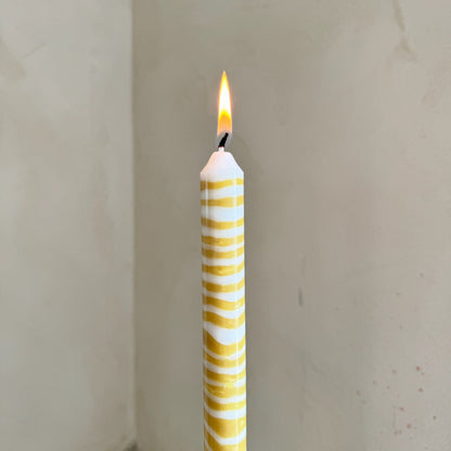 Piccalilli sculptural dinner candles by Pygmalion London, a hand-poured pair in mustard yellow and off-white