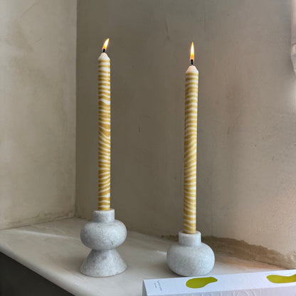 Piccalilli sculptural dinner candles by Pygmalion London, a hand-poured pair in mustard yellow and off-white
