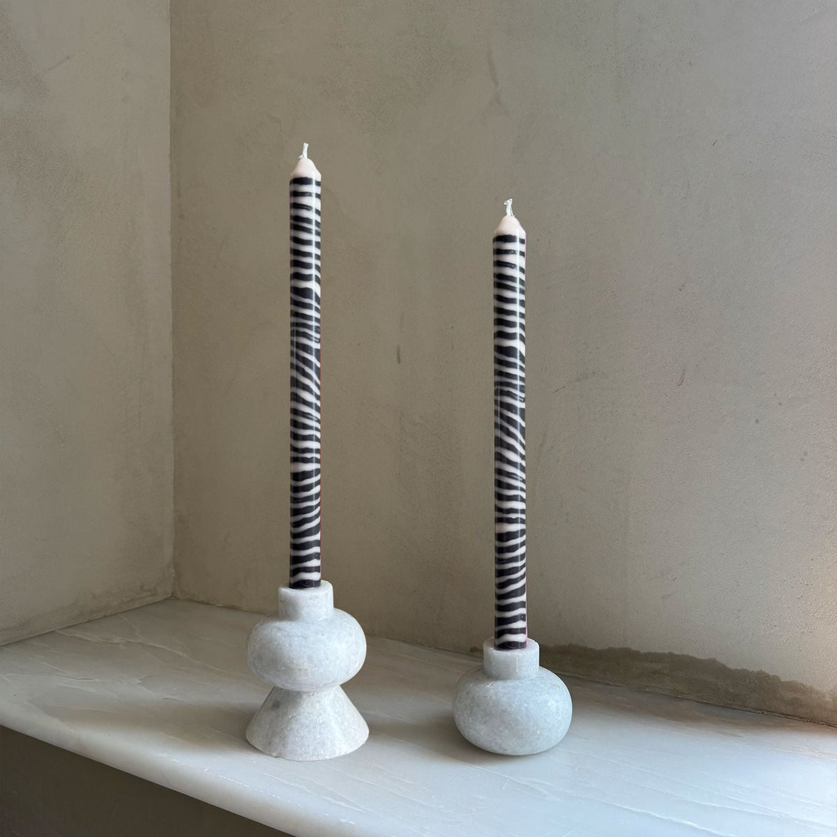 Shilling sculptural dinner candles by Pygmalion London, a hand-poured pair in charcoal and off-white