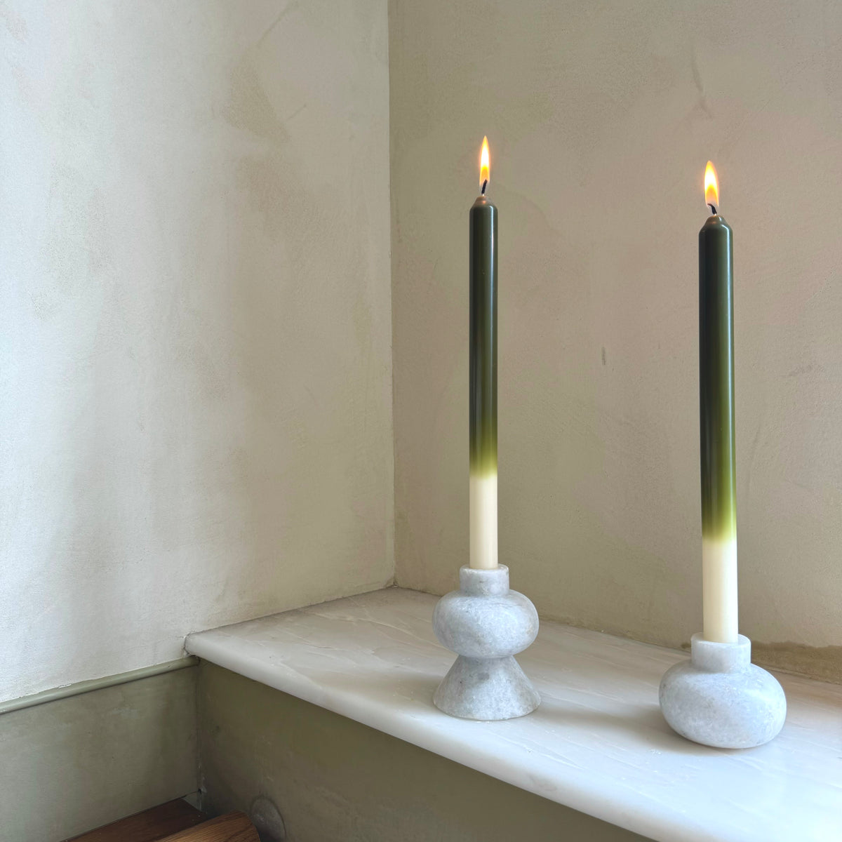 Olives ombré dinner candles by Pygmalion London, a hand-poured pair in deep olive green, chartreuse and off-white