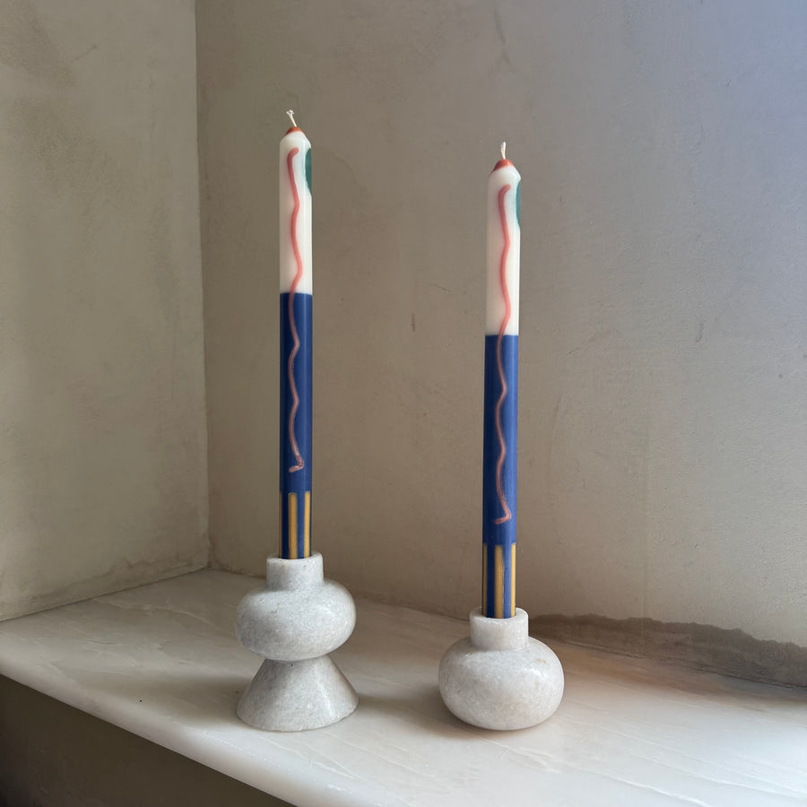 Terracotta patterned dinner candles by Pygmalion London, a hand-poured pair in blue, burnt orange, ochre, mustard yellow, racing green and red