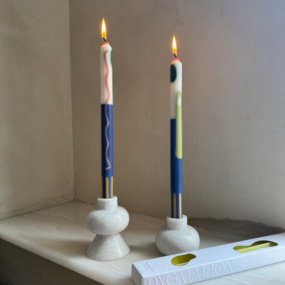 Terracotta patterned dinner candles by Pygmalion London, a hand-poured pair in blue, burnt orange, ochre, mustard yellow, racing green and red