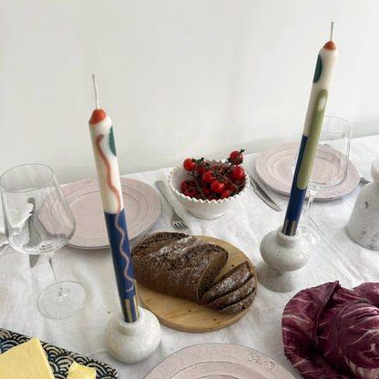 Terracotta patterned dinner candles by Pygmalion London, a hand-poured pair in blue, burnt orange, ochre, mustard yellow, racing green and red