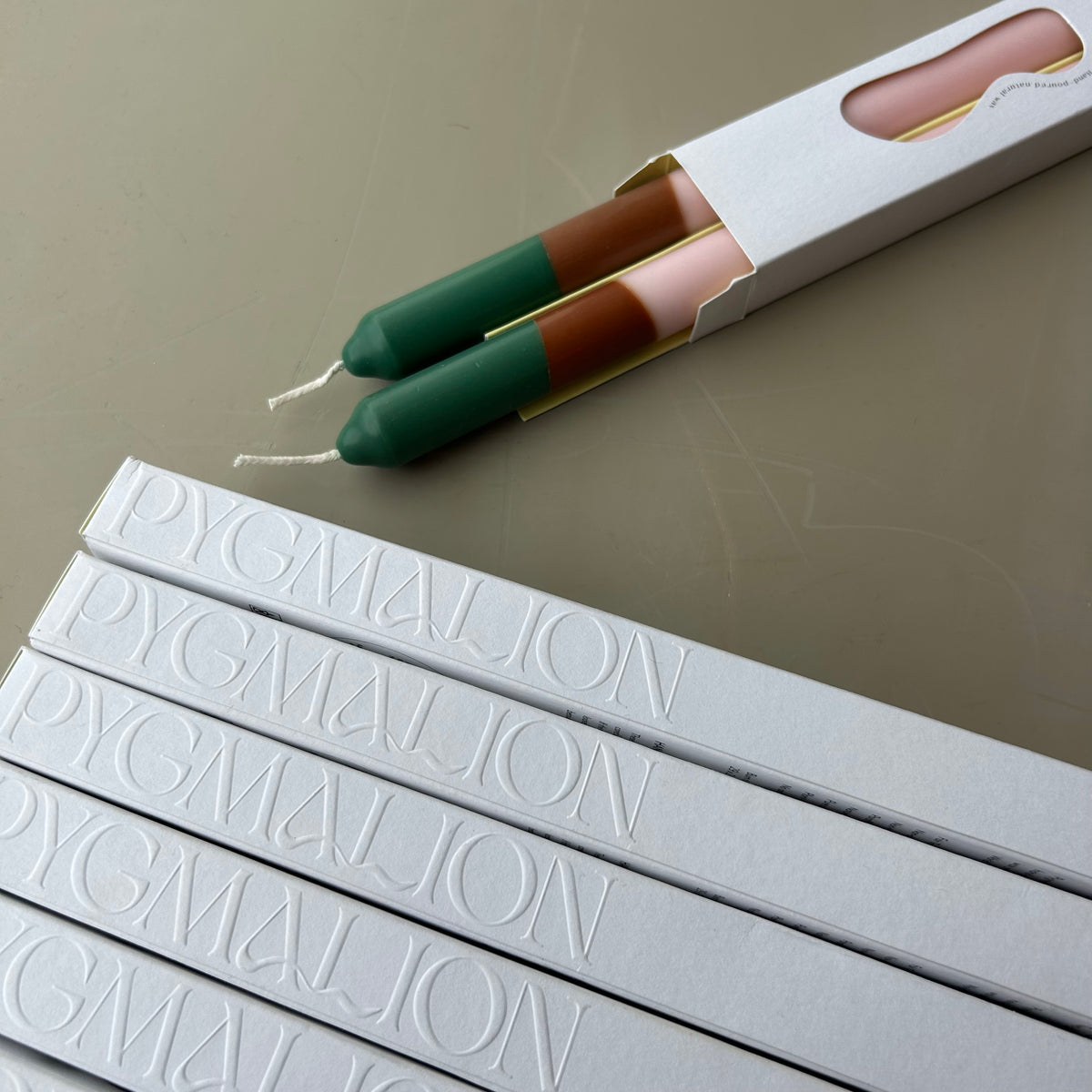 Woodstock colour block dinner candles by Pygmalion London, a hand-poured pair in soft pink, warm brown and mallard green